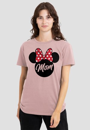 Pink cotton t-shirt featuring a black Mickey Mouse head graphic with a red polka dot bow and the word "Mom" in white cursive.