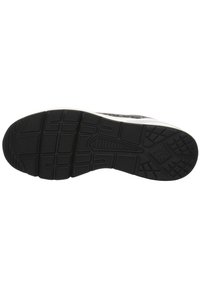 Black rubber shoe sole with a textured surface. Features deep treads and a zigzag pattern for grip. Edges are smooth with a slight curve.