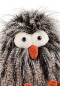 Plush owl toy with gray and black faux fur, large round white eyes, and an orange beak. Features a textured, fuzzy appearance.