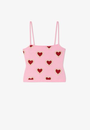 Różowy krótki top na ramiączkach z wzorem czerwonych serc obramowanych małymi białymi koralikami, równomiernie rozmieszczonymi na całej tkaninie.