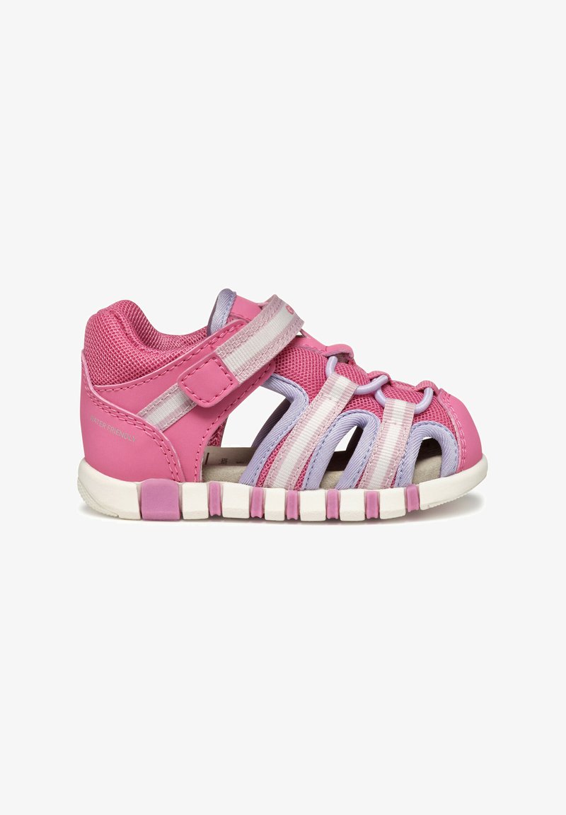 Pink and lavender water-friendly sandal with mesh and rubber materials, open design, Velcro strap, and segmented white sole.