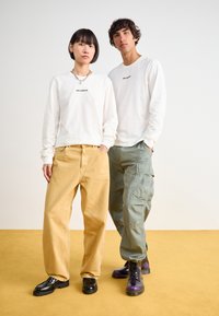 Salomon LOGO TEE UNISEX - T-shirts med print - white