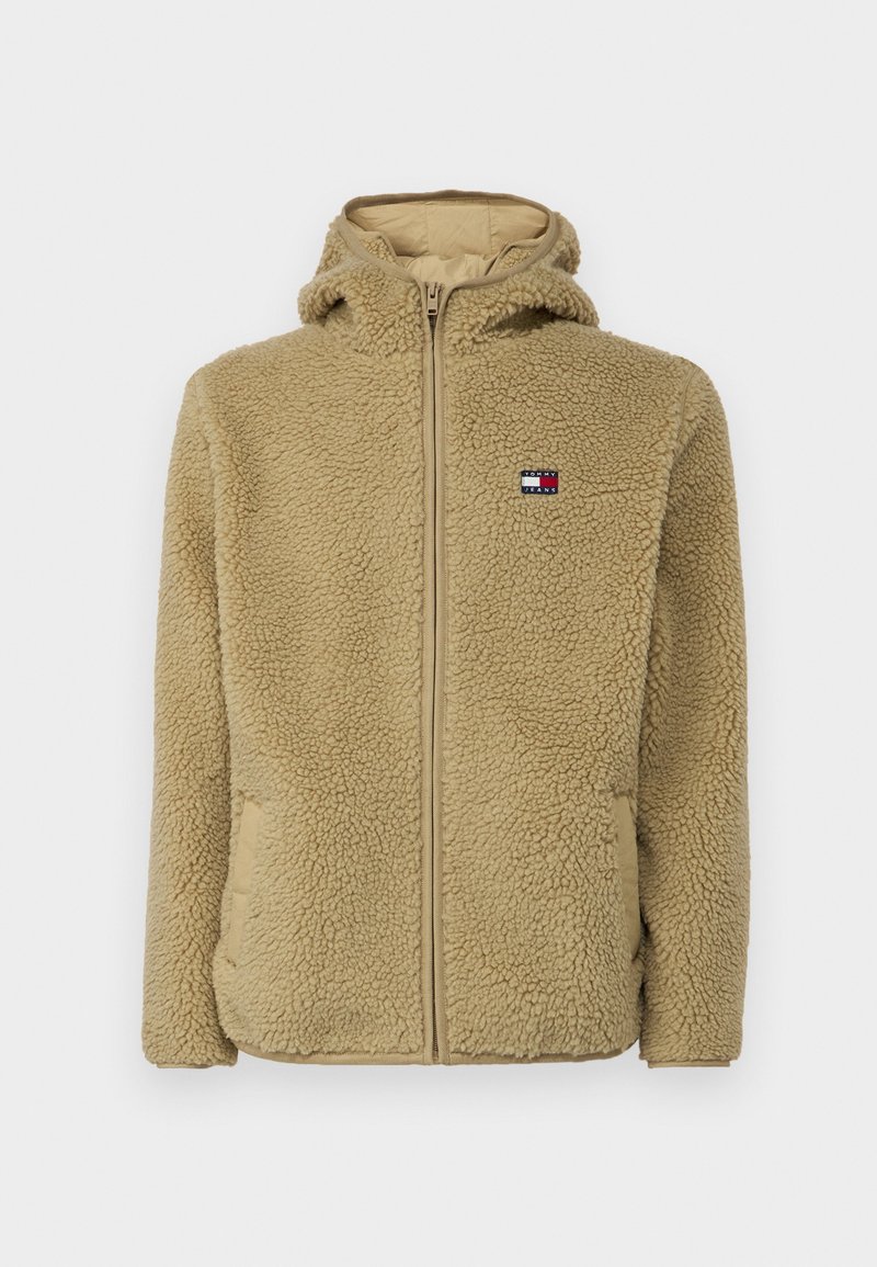 Beige Fleece-Hoodie mit vollem Reißverschluss, texturiertem Stoff und Seitentaschen. Verfügt über ein kleines LOGO-Patch im oberen linken Brustbereich.