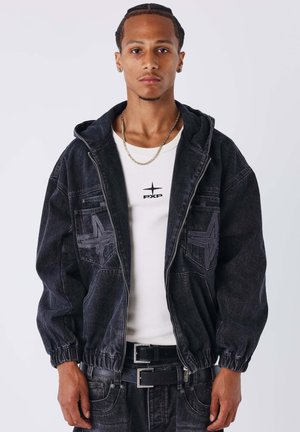 Men's black denim jacket with hood, elastic cuffs, and star pattern accents; worn over a white T-shirt featuring "PXP" logo.