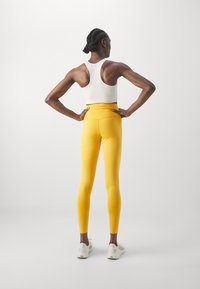 Girlfriend Collective LEGGING LONG - Tajice - golden glow