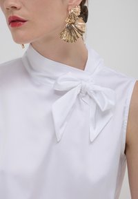 Calliope SMANICATA CON FIOCCO  - Top - bianco
