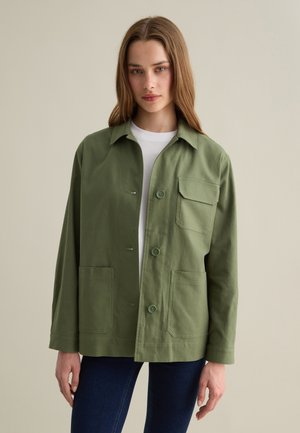 Olive green, button-up jacket with two front pockets and a collar. Made of lightweight fabric with a relaxed fit and long sleeves.