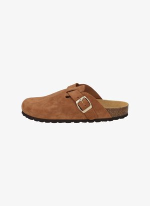 Brown suede clogs with a strap featuring a silver buckle. Cork footbed and textured black rubber sole. Open back design.