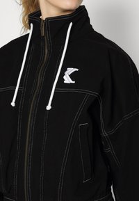 Karl Kani JACKET - Casaco de ganga - black