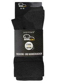 Schwarze Trekking- und Wandersocken aus Merinowolle. Sie verfügen über ein strukturiertes Design, sind mit der Größe 35/38 und dem Aufdruck "stabil & warm" versehen.