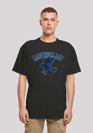 Black cotton t-shirt featuring a blue "Ravenclaw" text and a blue raven graphic. Short sleeves and a relaxed fit.