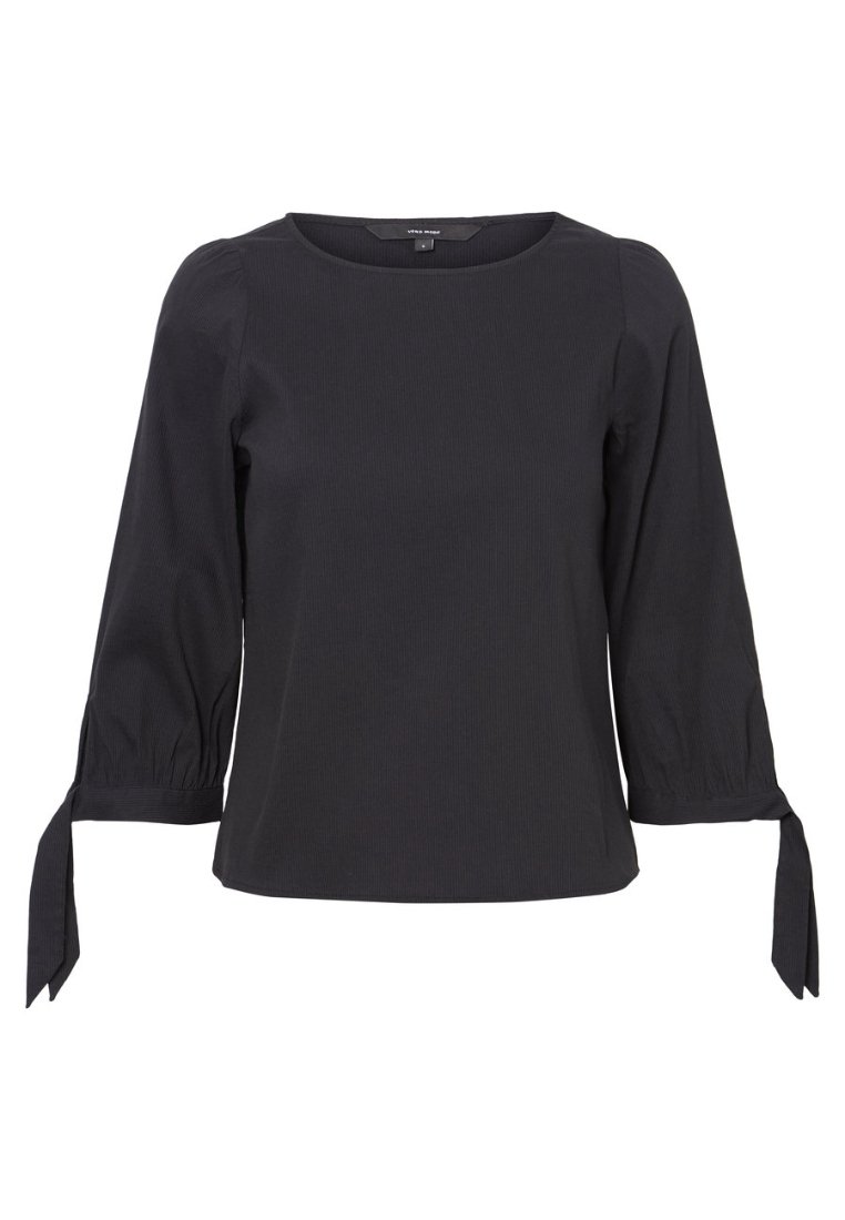 Blusa nera aderente con scollo rotondo, maniche a tre quarti a palloncino e dettagli con nodo ai polsini. Tessuto testurizzato con un motivo sottile.