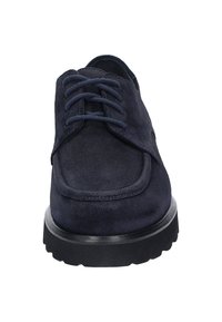 Navy suede lace-up shoe with a rounded toe, padded collar, and thick black rubber sole featuring a textured tread pattern.