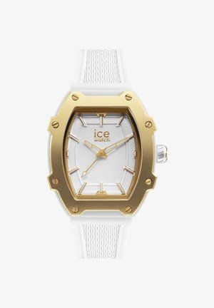 Witte siliconen horlogeband met een textuurdesign, gouden octagonale lunette, witte wijzerplaat en gouden uurmarkeringen en wijzers.
