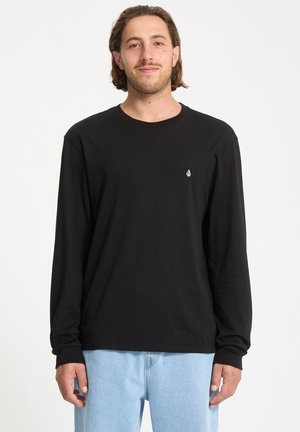 Sort langærmet t-shirt lavet af blødt stof, med rund halsudskæring og et lille hvidt logo på brystet. Casual pasform med ribbede manchetter.