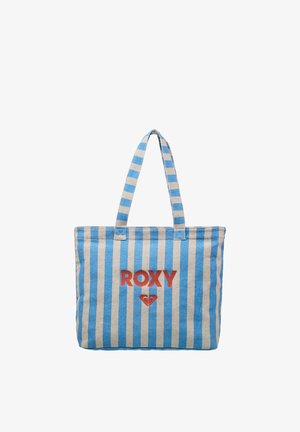 Sac fourre-tout rayé bleu et blanc avec deux anses et texte rouge "ROXY" avec logo centré sur le devant.