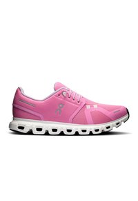 Zapatilla deportiva rosa con parte superior de malla, suela blanca y acolchado redondeado. Presenta logotipo, cordones y detalles de ventilación. Vista en perfil lateral.