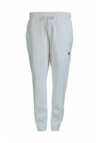 Witte joggingsbroek van zachte stof, met een elastische tailleband en een trekkoord, en een klein zwart logo aan de zijkant.