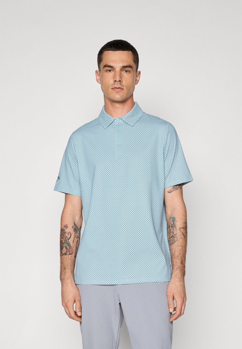 Light blue short-sleeve polo shirt with a patterned design, two-button collar, and a slightly loose fit. Fabric texture appears soft.