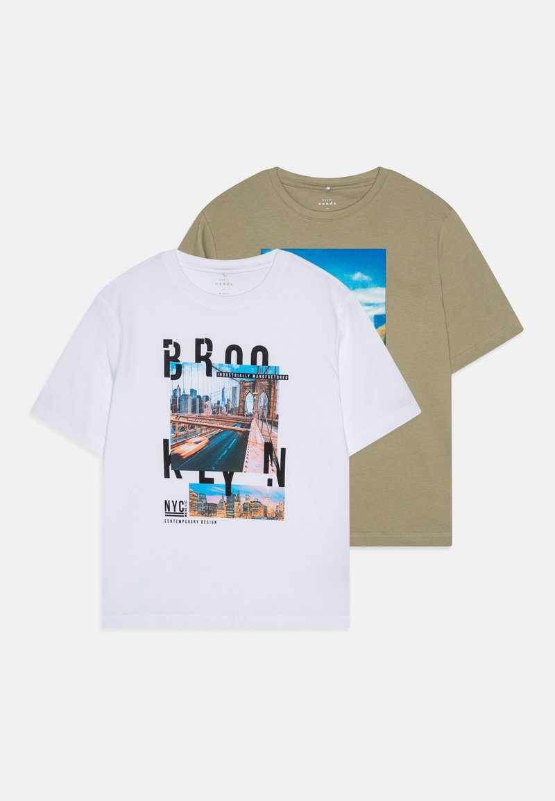 White cotton t-shirt with Brooklyn graphic and text, paired with olive green t-shirt featuring a blue sky photo. Short sleeves, casual fit.