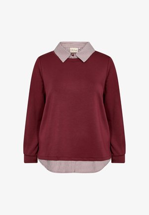 Bordový top s dlhým rukávom a pruhovaným golierom a lemom. Mäkkučká textúra, zaoblený lem a voľný strih. Golier má striedajúce sa biele a červené pruhy.