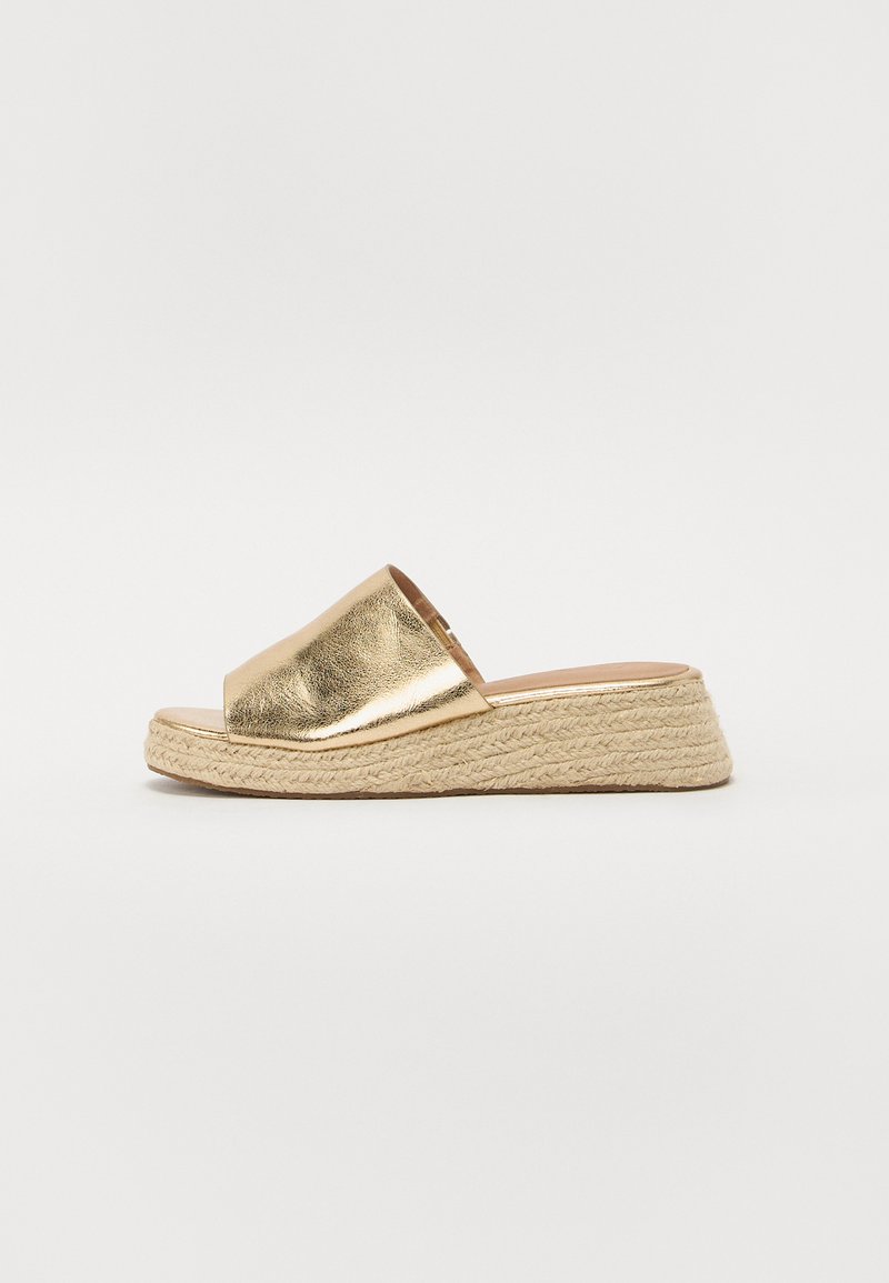 Gold metallic platform sandals with a wide band and open toe, featuring braided jute detailing on the wedge sole. Textured finish.