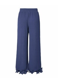 Pantalons larges bleu marine avec une finition texturée, dotés d'un ourlet à volants et d'une taille élastique pour plus de confort.