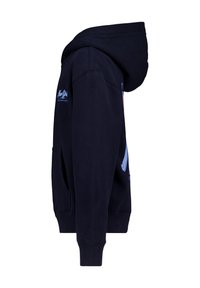 Tummansininen huppari, jossa on etutasku, säädettävä huppu ja logo-yksityiskohta hihassa. Pehmeä rakenne, ribbaatulla hihansuilla ja helmalla.