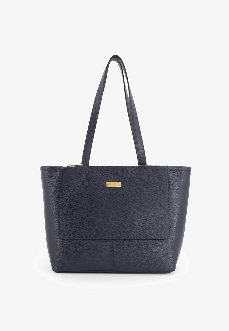 Navy leather tote bag with two long handles, a zippered top, and a metallic logo plate. Smooth texture with a structured shape and seam details.