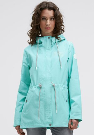 Light turquoise waterproof jacket with a hood, cinched waist, two side pockets, and white drawstrings. Features a logo on the left chest.