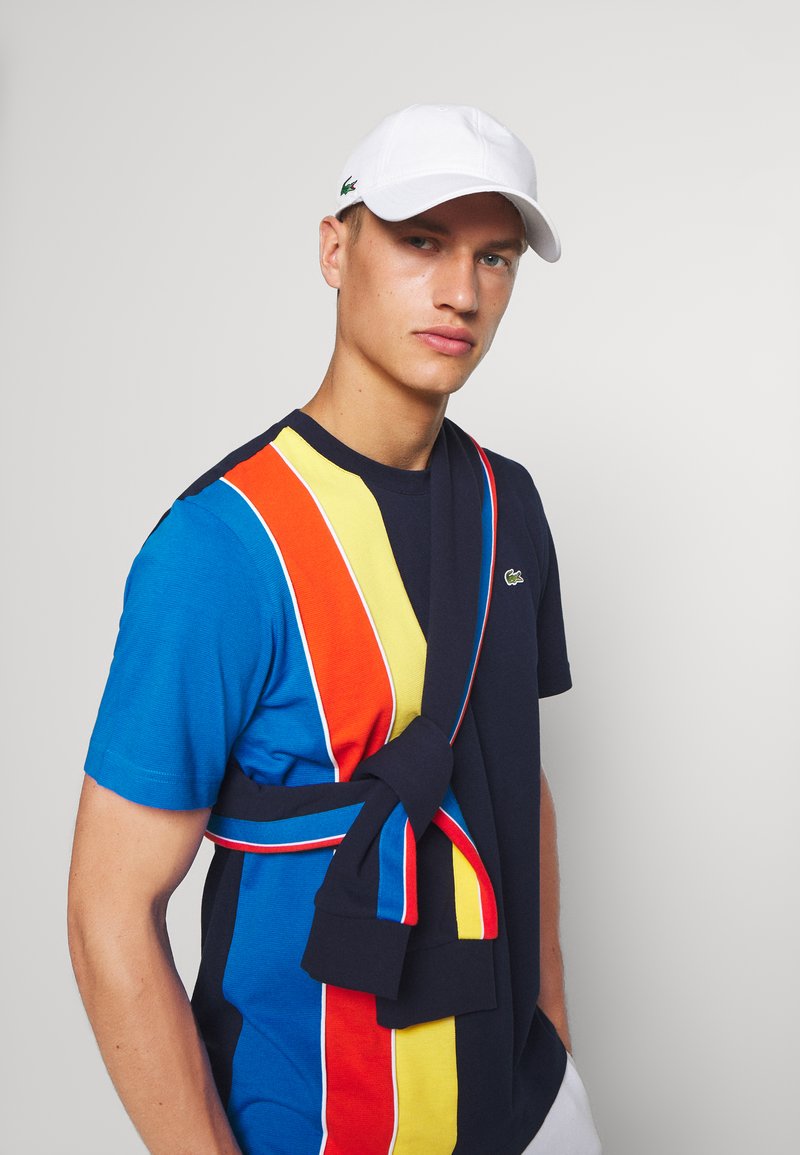 Lacoste Sport - TENNIS UNISEX - Naģene - white, Palielināt