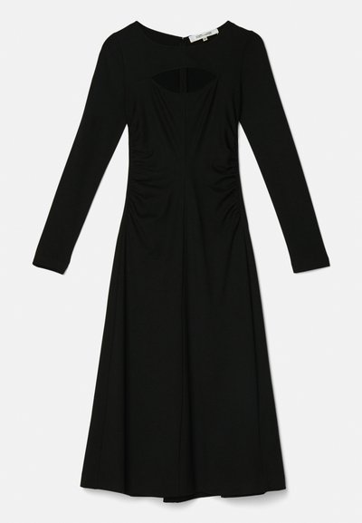 Μαύρο φόρεμα με μακριά μανίκια που διαθέτει στρογγυλή λαιμόκοψη, λεπτομέρειες κοπής, ρυτιδωτές πλευρές και φαρδύ φούστα από τη μέση μέχρι το στρίφωμα.
