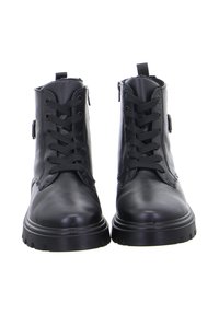 Bottines en cuir noir avec bout rond, devant lacé et zip sur le côté. Elles présentent des semelles en caoutchouc épaisses et des détails de couture renforcés.