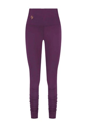 Violett leggings med hög midja, prydda med en subtil logo i guld, en smidig, stretchig design och rynkade detaljer vid anklarna.