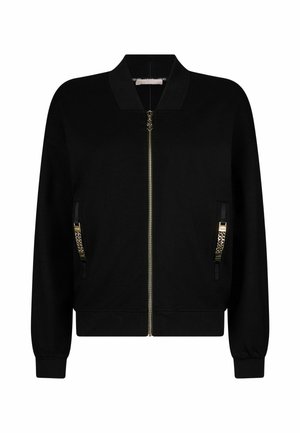 Juoda bombonešio striukė su užtrauktuku priekyje, dvi šoniniais užtrauktukais kišenės su auksinės spalvos detalėmis, ir austa rankogaliai bei apačia. Minkšta audinio tekstūra.