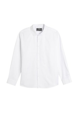 Chemise blanche à manches longues en coton. Elle possède un col classique, une fermeture à boutons à l'avant et des poignets à un bouton. Texture lisse, sans motifs.