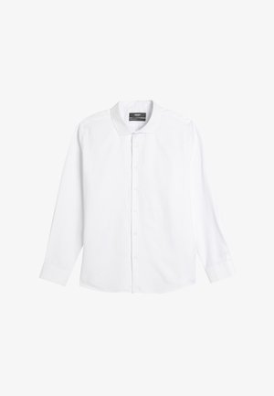 Chemise blanche à manches longues en coton. Elle possède un col classique, une fermeture à boutons à l'avant et des poignets à un bouton. Texture lisse, sans motifs.