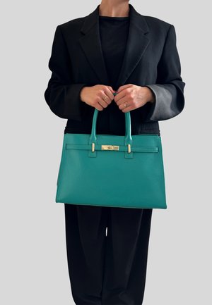 Skórzana torebka w odcieniu teal z fakturą, z podwójnymi uchwytami u góry, z centralnym złotym akcentem metalowym i ustabilizowanym prostokątnym kształtem.