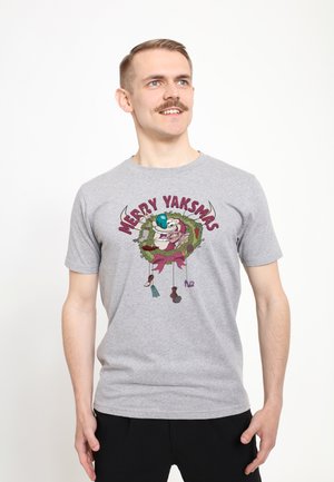 Gray t-shirt featuring a colorful graphic of cartoon characters with text "MERRY YAKSMAS," designed with a round neck and short sleeves.
