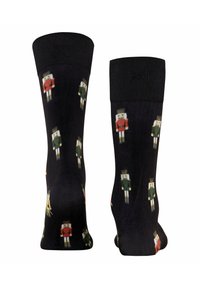 Czarne skarpetki z ilustracjami szopki w kolorach czerwonym i zielonym, z teksturowanym wzorem. Żebrowane mankiety zwiększają komfort i dopasowanie.