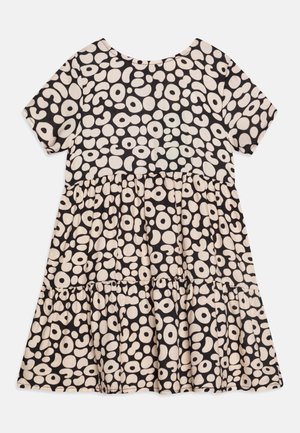 Black dress with short sleeves and a round neckline, featuring a cream abstract pattern, tiered skirt, and soft fabric texture.