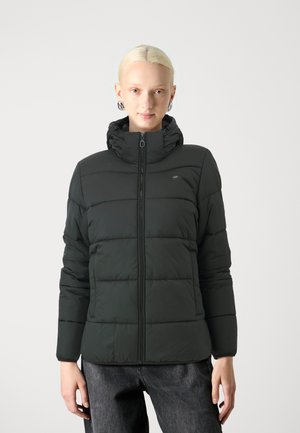 Black padded jacket featuring a zip closure, high collar, and long sleeves with a smooth texture. Includes a logo detail on the chest.