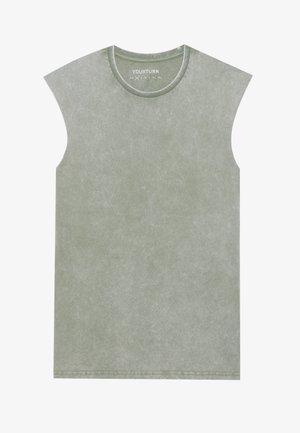 Zöld, ujjatlan póló, puha, texturált anyagból. Kerek nyakú, finom mosott hatással és látható varrásokkal az alján.