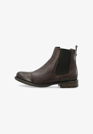Bottine en cuir marron avec panneau latéral élastique, bout arrondi et talon empilé. Présente une finition texturée et une tirante pour un enfilage facile.