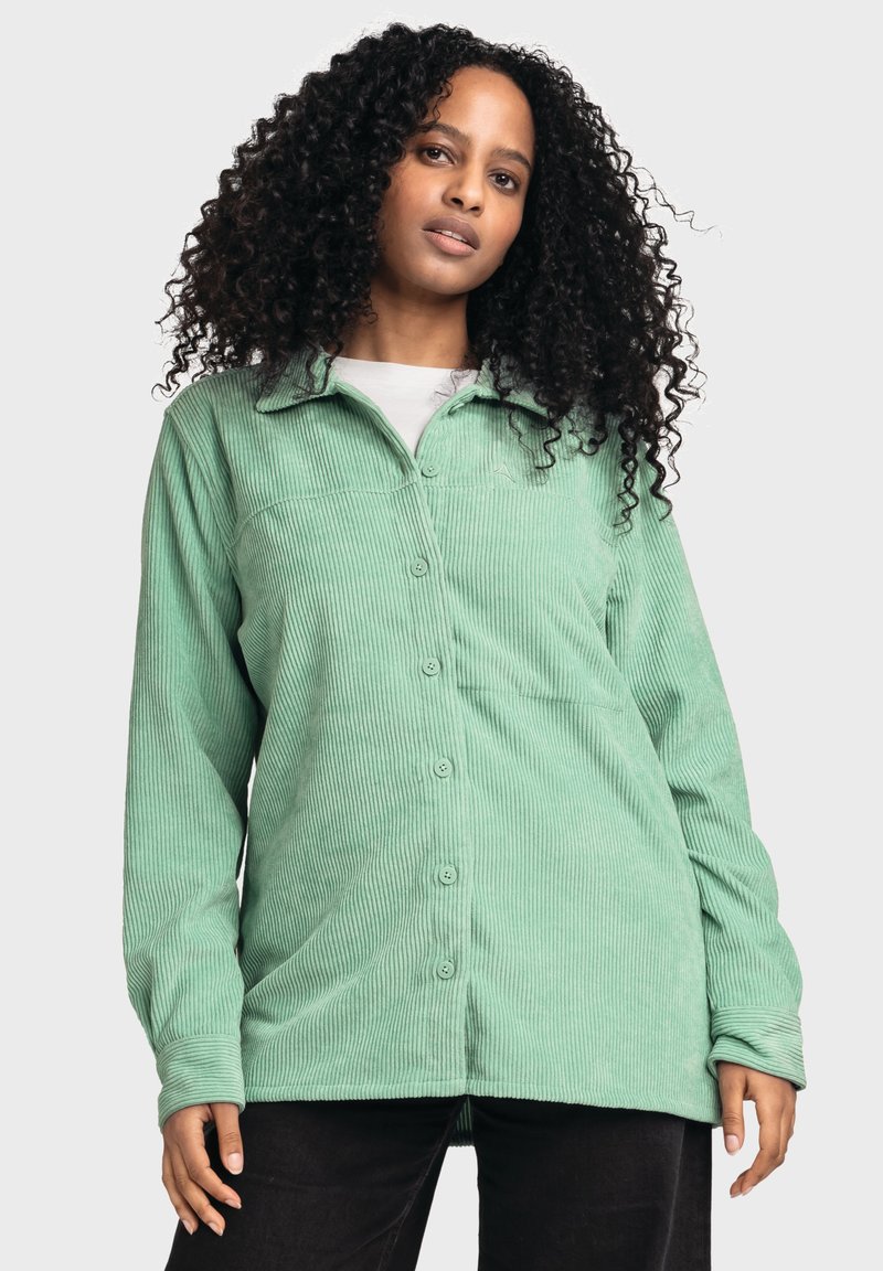 Green corduroy button-up shirt with a collar, featuring vertical ribs, long sleeves, and visible buttons down the front.