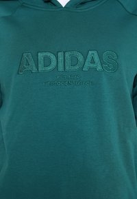 adidas Performance Jersey con capucha - dark green
