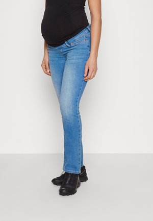 Maternity jeans in light blue denim, slim fit with a smooth texture, featuring a stretchy waistband for comfort. Black sneakers on feet.