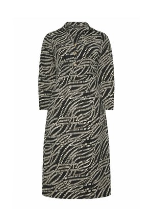 Musta-valkoinen kuvioitu polvipituinen mekko, jossa on pitkät hihat, kaulus ja kolme nappia edessä.