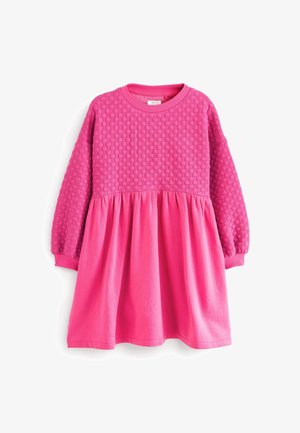 Langærmet lyserød kjole med en struktureret overdel og glat skørt, med en rynket talje samt ribstrikket halsudskæring og manchetter.