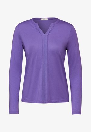 Fialový dlouhý rukáv top vyrobený z jemné látky, s V-výstřihem a středovým švem. Hladká textura s přiléhajícími rukávy.